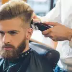 Young Man in Barbershop Hair Care Service Concept